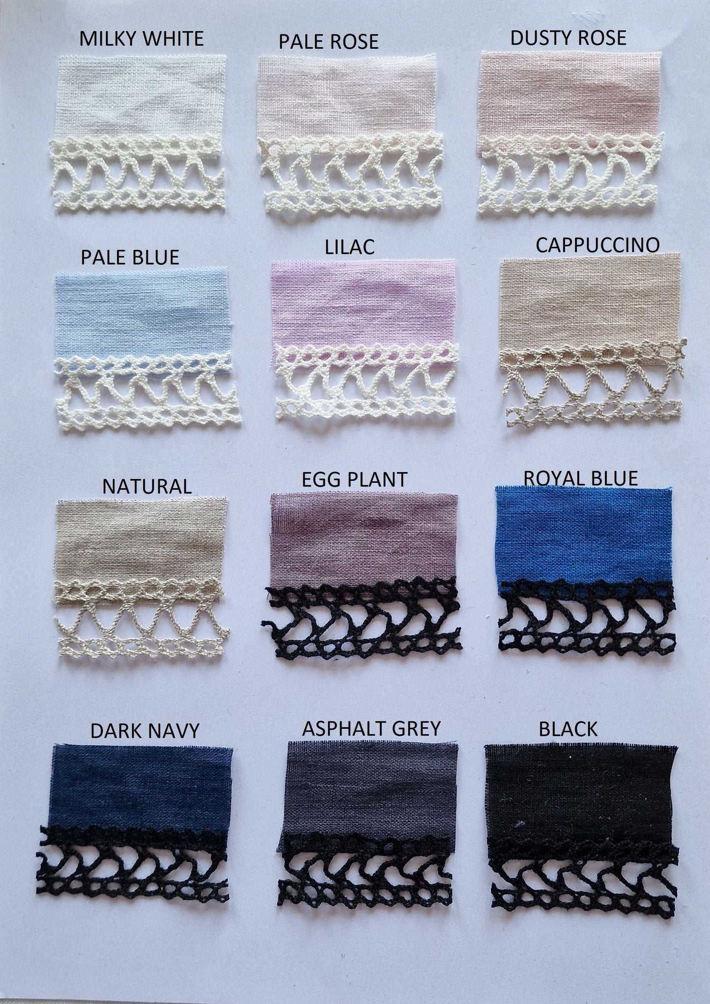 A collection of linen nightgowns in various colors, featuring wide lace shoulder straps and a gathered trapeze design with lace embellishments.