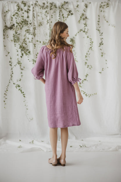 Vintage inspired peasant oversize dress with ruffles and ties in neck and sleeves